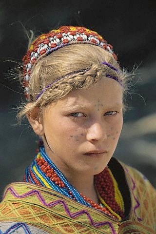 girl from kalash pakistan with facial tattoos